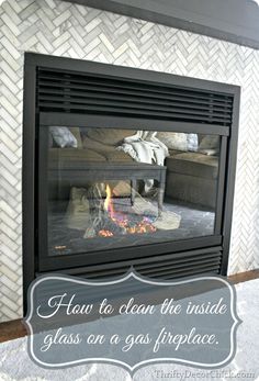 a fire place with the words how to clean the inside glass on a gas fireplace