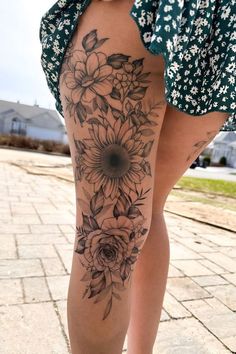 a woman's leg with flowers on it