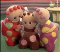 three stuffed animals are standing next to each other