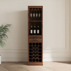 a tall wooden wine rack with bottles and glasses on it next to a potted plant