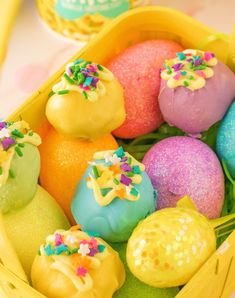 there are many different types of candies in the basket with ice cream behind them