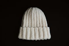 a white knitted hat on a black background