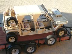 a toy truck with four large tires on the back