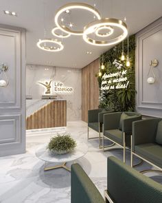 the lobby is decorated in white marble and features green chairs with round lights hanging from the ceiling