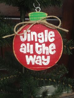 a christmas ornament hanging from a tree with the words jungle all the way on it