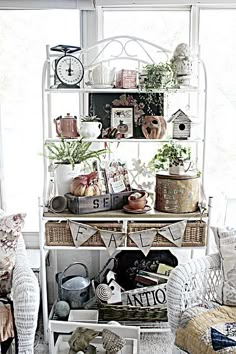 a living room filled with lots of furniture and decor on top of it's shelves