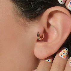 Add a splash of color with our Multicoloured Ring Tragus Piercing. Crafted from rhodium-plated xuping, also known as medical gold, this vibrant piece is perfect for helix, tragus, and cartilage piercings. Key Features: Material: Rhodium-plated xuping (medical gold) with a zircon stone. Dimensions: Inner diameter is 6 mm. Versatility: Suitable for helix, tragus, and cartilage piercings. Durability: Resistant to rust, color change, fading, and darkening; long-lasting even in pool and sea water. Ca Piercing Tragus, Cartilage Piercings, Tragus Piercing, Cartilage Earring, Earring Gold, Kids Earrings, Tragus Piercings, Sea Water, Cartilage Piercing