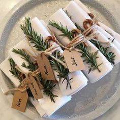 napkins wrapped in twine and tied with twine are sitting on a plate