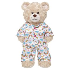 a teddy bear wearing pajamas with rainbows on it