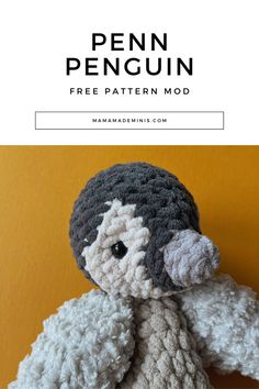 a crocheted stuffed animal with text overlay that reads, penn penguin free pattern