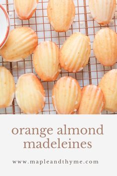 orange almonds on a cooling rack with the words orange almond madeleines above them