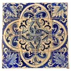 blue and white tile with an ornate design