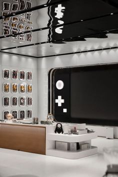 the interior of a modern fashion store with white and black decor