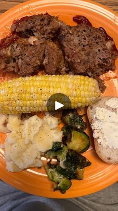 an orange plate topped with meat and veggies