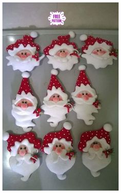 santa clause decorations are displayed on a table