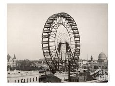 an old photo of a large ferris wheel