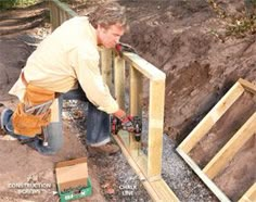 a man is working on the side of a house that has been built into the ground