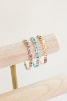 Add a touch of coastal elegance to your bracelet aesthetic with our handmade "Water" tila bracelets. The colorful delicate glass beads and stretchy design make this bracelet perfect for everyday wear or special occasions. All of our tila bracelets are designed to layer and stack, creating your own personal jewelry style. Tila Bracelets, Gold Bracelet Simple, Womens Jewelry Trends, Preppy Bracelets, Coastal Aesthetic, Tila Beads, Colorful Bracelet, Women's Jewelry Sets, Unique Bracelets