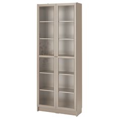 a tall bookcase with glass doors on the front and bottom shelves in light grey