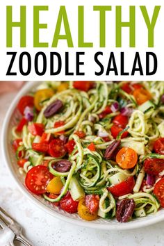 this healthy zoodle salad is loaded with zucchini noodles, tomatoes, and other veggies