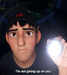 a man holding a light up to his face with the caption i'm not giving up on you