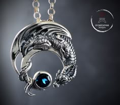 ** Dragon pendant in solid sterling silver and natural London blue topaz. Crescent dragon ** This beautiful pendant was born after working on the seventh season of the Game of Thrones series. Surrounded by stunning dragon designs, I decided to pay tribute to them and create my beautiful Drogon pendant. Made in sterling silver with a precious stone, in this case a spectacular London blue topaz. SYMBOLOGY ** I've always been fascinated by dragons. This strange creature has always been present in t Moon Dragon, Polymer Clay Dragon, Clay Dragon, Gold Skull, Dragon Necklace, Dragon Jewelry, Silver Dragon, Skull Jewelry, Dragon Pendant