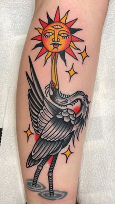 a bird with a sun on it's head is shown in this tattoo design