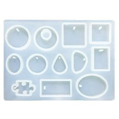 an assortment of plastic molds on a white background