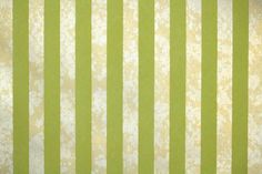 a green and white striped wallpaper pattern