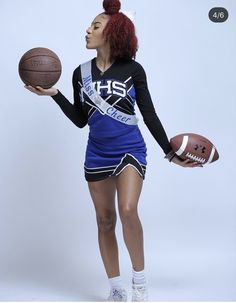 a woman in a cheerleader uniform holding a football and basketball ball with her right hand