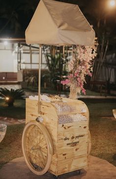 a wooden cart with an umbrella on top