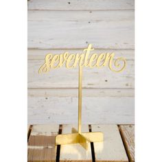 a cake topper that says seventeen on it in cursive font