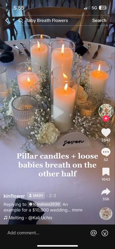 candles are arranged on a table with flowers and other things in the background, including an ad for baby breath flowers