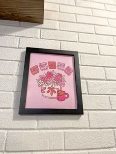 there is a painting on the wall with pink flowers and coffee mugs in it