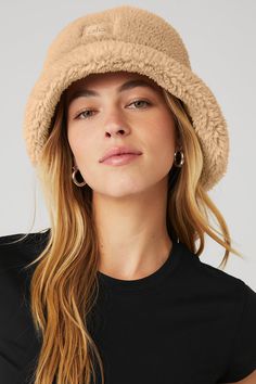 The iconic bucket hat just got a Sherpa update! Top off your cool-weather look with this plush Sherpa bucket hat, featuring a full, textured brim. Plush sherpa (faux fur) Center front woven patch Alo logo Teddy Bucket Hat Outfit, Teddy Bucket Hat, Sherpa Bucket Hat, Bucket Hat Outfit, Marketing Photography, Bucket Hat Black, Fall Hats, Woman Back, Outfits With Hats