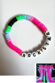 a bracelet that says rock's on it with neon colors and white beads in the middle