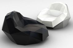 two black and white rocks sitting next to each other