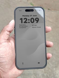 someone is holding up their iphone with the time displayed on it's display screen