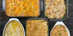 four casserole dishes with different toppings in them on a counter top next to a brick wall