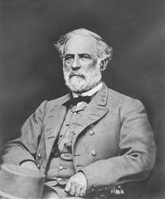 an old black and white photo of a man in a suit with a top hat