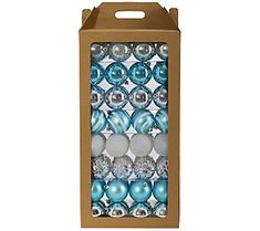 a cardboard box filled with blue and silver christmas bauble ornament balls