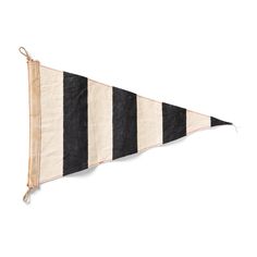 a black and white striped pennant hanging on a wall