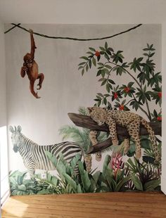 an animal themed wallpaper in a children's room with monkeys and zebras