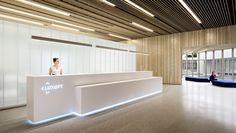 a woman standing at the front desk of a building