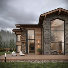 a modern house with large windows and wooden decking