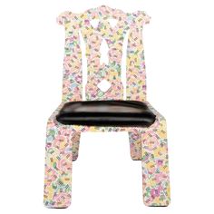 a wooden chair with colorful designs on it