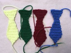 four crocheted ties are lined up together