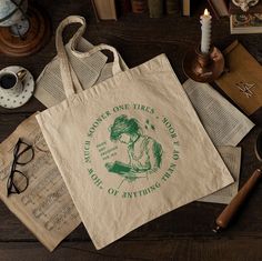 This bag displays a well-loved quote from Jane Austen's Pride and Prejudice, originally published in 1813, reading, "How much sooner one tires of anything than of a book." Made with 100% cotton, this canvas bag is the perfect gift for book lovers, readers, Jane Austen enthusiasts, or fans of the Regency historical era. I hope it's just what you were hoping to find!  Canvas Bag Details: -Made of 100% cotton canvas -Size: 15"x16," 20" handles Loved Quote, Elizabeth Bennett, Jane Austen Gifts, Shakespeare And Company, Historical Eras, Bag Display, Bag Details, Gifts For Readers, Pride And Prejudice