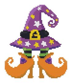 a cross stitch pattern with a witch's hat on top of an orange pumpkin