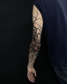 a man with a tattoo on his arm